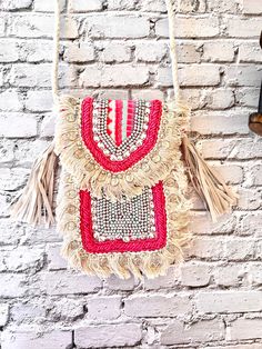 Pink and off white mobile sling bag beaded with stones and fringes on sides made of jacquard fabric . Beige Phone Bag For Beach, Bohemian Shoulder Bag With Mobile Phone Bag For Vacation, Bohemian Style Mobile Phone Bag For Beach, Bohemian Beach Mobile Phone Bag, Bohemian Beach Bag For Mobile Phone, Bohemian Mobile Phone Bag For The Beach, Bohemian Beaded Shoulder Bag For Summer, Bohemian Beaded Shoulder Bag For Vacation, Bohemian Beaded Bags For Vacation