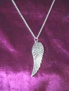 This is for a beautiful large Tibetan silvertone angel wing necklace on an 18" chain.  Wing measures 2".  Tibetan silver is a nickel-free alloy which does not rust or tarnish.  It is not 925 sterling silver.  This item is costume/fashion jewellery only and is not made of precious metal. Elegant Winged Silver Necklace, Angel Necklace Silver, Elegant Sterling Silver Winged Necklace, Angel Wing Necklace Silver, Nickel-free Sterling Silver Angel Wing Jewelry, Angel Wing Necklace, Wing Necklace, Precious Metals, Charm Necklace