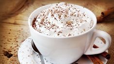 a cup of hot chocolate with whipped cream on top