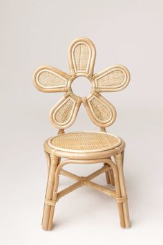 a wicker chair with an intricate design on the back