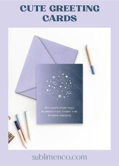 a card with the words cute greeting cards on it next to some pencils and an envelope