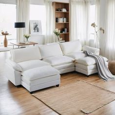 a large white sectional couch in a living room