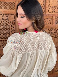 This Mexican Traditional Blouse has beautiful embroidered flowers that are hand embroidered in the San Antonino Style. This beautiful loose fitting blouse gives you both style and comfort. The front and upper back have a beautiful lace design. The blouse is made in Mexico by Artisan Hands made with love for you. This blouse comes one size which is ideal for sizes S,M and L. Shop the hand painted earrings modeled here: https://www.etsy.com/es/listing/802949597/aretes-artesanales-pintado-a-mano-ar Hand Embroidered Blouse, Mexican Blouse, Hand Painted Earrings, Balloon Sleeve Top, Painted Earrings, Beautiful Blouses, Green Blouse, Lace Design, Embroidered Blouse