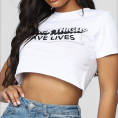 Unworn Crop Top, With The Tags Still On From Fashion Nova. I Paid Full Price, Phrase Says: “Thick Thighs Save Lives” Fits True To Size, Very Soft And Comfortable. Original Price: 14.99 Edgy Fitted Tops With Text Print, Edgy Fitted Slogan T-shirt, Edgy Fitted T-shirt With Slogan, Edgy Stretch Crop Top With Letter Print, Summer Fitted Cropped T-shirt With Slogan, Edgy Letter Print Crop Top T-shirt, Fitted Cropped Top With Text Print, Fitted Text Print Cropped Tops, Stretch Graphic Tee With Slogan