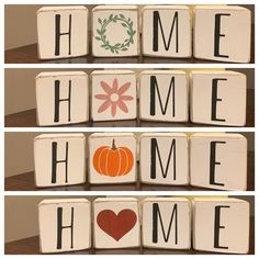 the word home spelled with wooden blocks and pumpkins