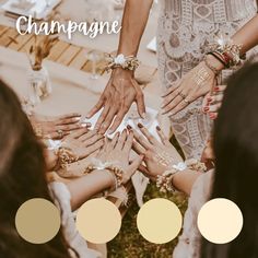 a group of people with their hands on top of each other and the words champagne