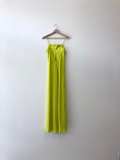 Long silk slip in chartreuse    bias cut silk maxi length slip with fixed spaghetti straps. straight cut neckline at front and v at back. designed specifically to be layered under the meiere dress.    100% sueded silk charmeuse. matte side out. sustainably and ethically made in california.    size guide Green Bias Cut Slip Dress With Spaghetti Straps, Green Slip Dress With Spaghetti Straps And Bias Cut, Green Silk Slip Dress With Spaghetti Straps, Spring Silk Cami Slip Dress, Summer Backless Bias-cut Slip Dress, Spring Evening Camisole With Spaghetti Straps, Silk Bias Cut Slip Dress For Summer, Summer Silk Camisole Slip Dress, Summer Silk Slip Dress With Delicate Straps