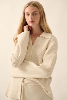 Solid, ribbed knit cardigan sweater. Collared V neckline. Button-front closure. Long sleeves. Drop shoulder. Oversized fit. 30% Polyester, 24% Acrylic, 20% Viscose, 20% Nylon, 6% Wool. Imported. Designed in LA. Model wears size S. Knit V-neck Cardigan With Ribbed Collar, Oversized V-neck Sweater For Spring Workwear, Chic Knit V-neck Polo Sweater, Oversized V-neck Polo Sweater For Fall, V-neck Sweater With Button Closure For Loungewear, Classic Oversized V-neck Sweater, Oversized Collared Sweater For Work, Classic Oversized Ribbed Tops, Long Sleeve Ribbed V-neck Sweater For Work