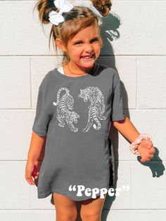 Dress your Little One trendy with this cute Kids Vintage Tigers Shirt! Comfort Colors® Tshirts are super soft and comfy! Size up for a Trendy Oversized look! ♥ Hello and Welcome to Meaningful Tees Shop! ♥ All of our items are made one at a time with care for each customer : ) ♥ Please allow 3-7 BUSINESS days (usually 3-5) for your item to be created PLUS shipping time via USPS ♥ Printed on the highest quality Youth Tshirt, the Comfort Colors 9018 is 100% Heavyweight Garment Dyed Cotton. Super so Cute Gray Short Sleeve T-shirt, Playful Relaxed Fit Soft-washed Tops, Playful Crew Neck Tops, Cute Gray Crew Neck T-shirt, Playful Soft-washed Crew Neck Tops, Family Matching Gray Short Sleeve T-shirt, Gray Family Matching Short Sleeve T-shirt, Gray Short Sleeve Family Matching T-shirt, Family Matching Gray Short Sleeve Tops