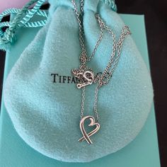 Tiffany & Co Loving Heart Pendant Necklace. Mini Size. 16” Chain, Sterling Silver, Paloma Picasso. Gently Used Condition. Will Look Brand New With Gentle Cleaning. Comes With Dustbag, Box, Bag And Ribbon. Luxury Sterling Silver Open Heart Necklace, Luxury Sterling Silver Heart Pendant Necklace, Luxury Sterling Silver Heart Necklace For Formal Occasions, Luxury Heart Shaped Sterling Silver Necklace, Luxury Heart-shaped Sterling Silver Necklace, Luxury Silver Open Heart Necklace, Luxury Open Heart Necklace For Formal Occasions, Elegant Heart Detail Necklace For Valentine's Day, Sterling Silver Heart Charm Necklace For Formal Occasions