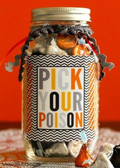 a jar filled with lots of candy sitting on top of a table