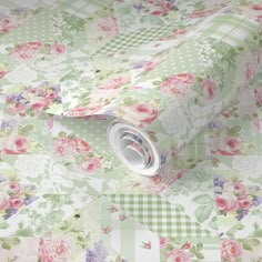 a floral wallpaper with pink flowers and green checkers