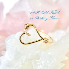 This sideways heart ring features an open heart design in 14K gold filled or sterling silver, perfect for any occasion. A thoughtful Mother's Day present, this custom heart outline ring makes a beautiful gift for women who love elegant, minimalist jewelry. ✦100% Handcrafted ✦ High quality 14K gold filled, 14K rose gold filled or sterling silver argentium ✦ Ring arrives in either a pink microfiber suede envelope/pouch or a blue/green drawer cardboard box as seen in the last image of this listing. ✦ Ready to ship in one business day ✦ Average shipping time (US/Canada/UK) three to five business days ✦ Tracking Available ✦Band  Width--1mm Color--gold, rose gold or silver Shape--round Texture--smooth Material--14K gold-filled, 14K rose gold-filled or sterling silver argentium wire Gauge--20 ✦US 14k Gold Filled Hypoallergenic Rings For Gift, Hypoallergenic 14k Gold Filled Rings For Gift, Adjustable Gold Heart Ring For Valentine's Day, Delicate Gold Heart Ring In Sterling Silver, Adjustable Yellow Gold Stackable Rings For Valentine's Day, 14k Gold Filled Stackable Rings For Anniversary, Gold Stackable Open Rings For Valentine's Day, Gold Heart Ring In Sterling Silver As Gift, Gold Sterling Silver Heart Ring For Wedding