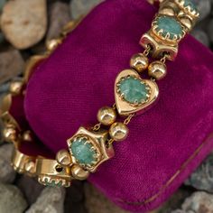 This delightful bracelet is accented with eleven (11), prong set, oval cabochon cut natural jadeite jade. The bracelet measures 11.3mm wide, 7.0mm thick and an overall length of 7 inches. The bracelet is finished with a hidden box clasp and safety chain. The bracelet fits a 6.75 inch wrist. Antique Gold Bracelet, Eleven 11, 18k Gold Bracelet, Slide Bracelet, Green Bracelet, Blue Green Sapphires, Safety Chain, Box Clasp, Hand Embroidery Art