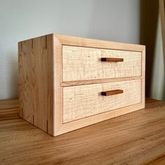 a wooden box sitting on top of a table