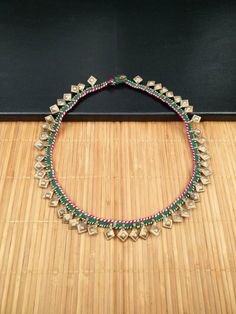 This is an Afghan kuchi tribal necklace/ trim. It's an old handmade Afghan banjara vintage necklace made from a trim. You can remove the button and button hole and can use it as a trim also. There are 48 dull antique silver charms attached to a green and pink cotton trim hanging in the necklace. The round length of the necklace is 24 inches. Please give room for some imperfections as its all handmade. There may be some patina also due to the age as it's a vintage item. Schmuck Diy, Button Hole, Jewelry Diy, Pink Cotton, Boho Necklace, Silver Charms, Vintage Necklace, Antique Silver, Charm Necklace