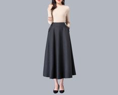 * A high-end long wool skirt with wide hem, very cool. * Made of wool blends, fully lined and with two side pockets. * Fixed waist on front, partial elastic waist on back and side invisible zipper. * Can custom make waist size and skirt length. * Material: Outer-50% wool, 50% polyester; lining-100% polyester * Washing instructions: Dry Clean Only * Size: True to US size, US 0-US 20 are available, you can let us know your usual size and height in your order. * Shipping: Free shipping Processing t Winter Office Skirt With Pockets, Elegant Fall Maxi Skirt With Pockets, Elegant Fall Skirt With Pockets, Winter Full Maxi Skirt With Pockets, Flared Maxi Skirt For Fall Office Wear, Brown Maxi Skirt With Pockets For Fall, Brown Wide Leg Winter Skirt, Long Skirt With Pockets For Fall, Fall Maxi Skirt With Pockets