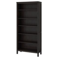 the bookcase is dark brown and has three shelves on each side, with one door open