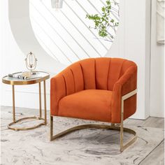 an orange chair sitting next to a side table