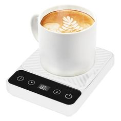 a cup of coffee sitting on top of a scale