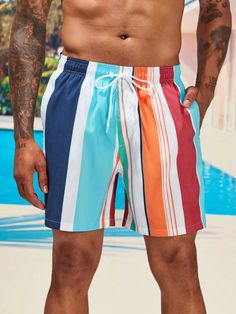 Make a statement with our Colorful Striped Swim Shorts. These swim shorts feature a captivating combination of bold and vibrant colors in a striped pattern, creating a lively and energetic look. The colorful stripes add a sense of fun and individuality to your swimwear, making it a perfect choice for beach outings or poolside lounging. Details: Pattern Type: Striped Details: Patched, Drawstring Type: Bottoms Bottom Type: Shorts Fabric: Non-Stretch Composition: 100% Polyester Care Instructions: M Multicolor Swimwear With Built-in Shorts For Vacation, Summer Striped Color Block Swimwear, Multicolor Short Bottoms For Vacation, Multicolor Vacation Bottoms Short Length, Multicolor Short Length Bottoms For Vacation, Casual Multicolor Bottoms For Vacation, Striped Color Block Swimwear For Vacation, Striped Swim Trunks For Swimming, Striped Swim Trunks For Beachwear