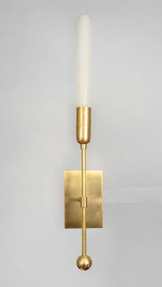 Brighten your home with the TASSEL 1 Sconce, a stunning wall light that beautifully merges modern design with mid-century charm. Featuring a sleek glass tube, this sconce provides soft, ambient illumination, creating a warm and inviting atmosphere in any room. The raw brass accents add a touch of elegance, enhancing the overall aesthetic and making it a versatile choice for various decor styles. Ideal for hallways, living rooms, or bedrooms, the TASSEL 1 Sconce serves both functional and decorative purposes, effortlessly elevating your interior space. Its minimalist design ensures it complements rather than overwhelms your decor, while the durable materials promise longevity and quality. Easy to install, this wall sconce is perfect for anyone looking to enhance their lighting solutions wit Brass Sconces, Brass Accents, Elegant Lighting, Light Sconces, Modern Glass, Live Light, Ceiling Light Fixtures, Raw Brass, Lighting Solutions