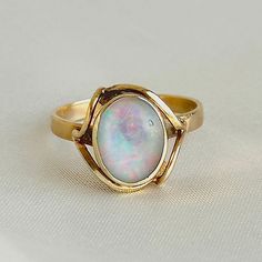 Vintage 10k solid yellow gold bezel set Opal cabochon ring Weight: 2.51g (approx)  Size: US 7  Condition:  Cabochon has one minor chip on the top right and the band has some noticeable but light scratching and denting Cabochon Ring, Pretty Jewellery, Chicago Il, Solid Yellow, Rings Statement, Statement Rings, Jewelry Rings, Opal, Chicago