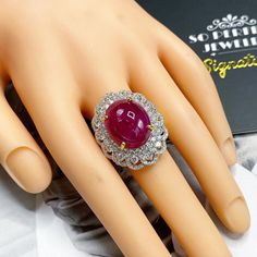 What you see in the pictures, is what you will get! No duplicates or twins! One of a kind EXTREMELY GORGEOUS AND RARE CERTIFIED NO-GLASS-FILLING, GENTLE HEAT ONLY, VIVID RED, BURMESE RUBY RING. This ruby is so rare! At 18.46 carats! Extremely huge! With stunning vivid red color and excellent depth and translucent quality, VS clarity. Rare BURMESE, signature RED Color, EXTREMELY BEAUTIFUL! With SUBSTANTIAL halo of brilliant round, F/VS diamonds. Set in a LUXURIOUS DESIGNED, 18K solid yellow gold Luxury Ruby And Diamond Oval Cabochon Ring, Luxury Ruby Ring With Oval Cabochon Diamond, Luxury Ruby Cabochon Diamond Ring, Luxury Cabochon Ruby Ring For Anniversary, Formal Ruby Ring With Diamond And Oval Cabochon Shape, Formal Oval Cabochon Ruby Ring With Diamond, Formal White Gold Ruby Cabochon Ring, Formal White Gold Cabochon Ruby Ring, Wedding Ruby Ring With Cabochon