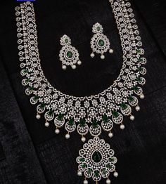 **Exquisite Diamond Replica Haram Necklace Set** Transform your look with our stunning Diamond Replica Haram Necklace Set, designed to bring unmatched elegance to your special occasions. This beautifully crafted jewelry set is perfect for brides and anyone looking to add a touch of luxury to their ensemble. **Product Details - **Materials High-quality diamond replicas that offer brilliance and durability. - **Design Intricate haram necklace with matching earrings, combining traditional craftsman Traditional White Gold Bridal Necklace For Wedding, Traditional Hand Set Diamond Necklace For Wedding, Traditional Hand-set Diamond Necklace For Wedding, Traditional White Gold Diamond Necklace For Wedding, Traditional Diamond White Diamond Necklace, Wedding Lab Grown Diamond Cut Ring, Elegant Bridal Necklace With Stone Work And American Diamond, Traditional Diamond Necklace For Wedding, Gold Lab Grown Diamond Necklace For Wedding