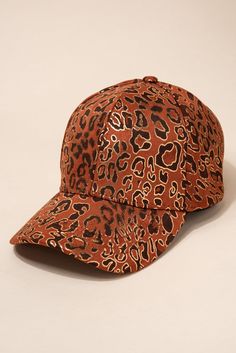 This ball cap is for ladies that love soft materials, leopard print and gold. Our unique hat accessory is made from a soft tan material and has leopard prints through the cap. To top if off, there are shiny gold accents to highlight your style. Size • Cap is adjustable. One size fits most• Length: 10.5 in (26.67 cm) • Width: 7 in (17.8 cm)• Height: 5.5 in (14 cm) Quality Cap made from 100% polyester blend ImportedHTC2658 Trendy Gold Baseball Cap With Curved Brim, Trendy Brown Baseball Cap With Curved Visor, Trendy Adjustable Gold Baseball Cap, Trendy Gold Cap, Trendy Gold Snapback Baseball Cap, Adjustable Gold Hats For Fall, Adjustable Gold Hat For Fall, Trendy Gold Snapback Hat, Trendy Adjustable Gold Hats