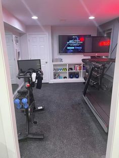 a home gym with treadmills and exercise equipment