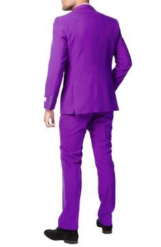 Watch your friends grimace and turn green with envy when you stride into the room sporting a regal purple suit featuring a slim, two-button jacket, sharply creased flat-front trousers and a matching to tie that pulls the whole look together. Jacket has a two-button closure, notch lapels; nonfunctional four-button cuffs; chest pocket; front flap pockets; side vents. Trousers have a zip fly with button-tab closure; front slant pockets; back welt pockets. Fully lined. 100% polyester. Dry clean or m