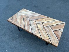 a coffee table made out of wooden planks