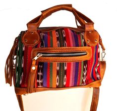 "Crossbody shoulder day bag genuine Tan leather color combined with a vibrant Guatemalan pattern (small size, pictured) Strong red cotton lining 1 external & 1 internal zip pocket 2 internal quick grab pockets Pom tassel and dust bag for free. Premium hardware. Perfect weekender, diaper or overnight bag. Small W14 x H11 x D5\" (Drop handle 7\") Strap max 52\" Intermedia W17 x H13 x D5\" (Drop handle 7\") Strap max 52\" Medium W20 x H13 x D7 \" (Drop handle 7\") Strap 31.5 - 39\" Feel free to Red Satchel With Zipper Pocket For Daily Use, Red Satchel Shoulder Bag With Zipper Pocket, Multicolor Satchel With Zipper Pocket For Everyday Use, Multicolor Crossbody Satchel With Zipper Pocket, Multicolor Satchel With Zipper Closure, Multicolor Rectangular Satchel With Zipper Pocket, Multicolor Leather Pouch Shoulder Bag, Multicolor Crossbody Bag With Zipper Pocket, Casual Multicolor Shoulder Bag With Zipper Pocket