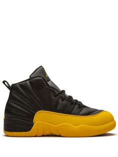 Black/university gold-tone leather/rubber Jordan 12 Retro sneakers from JORDAN featuring round toe, flat rubber sole, front lace-up fastening, branded insole and pull-tab at the heel. These styles are supplied by a premium sneaker marketplace. Stocking only the most sought-after footwear, they source and curate some of the most hard to find sneakers from around the world. | Jordan Kids Jordan 12 Retro sneakers Jordan Low-top Basketball Shoes With Abzorb Midsole, Jordan High-top Shoes With Boost Midsole For Sports, Yellow High-top Basketball Shoes For Training, Yellow Basketball Shoes With Round Toe, Yellow Basketball Shoes For Sports With Round Toe, Sporty Jordan Shoes With Contrast Sole, Yellow Sneakers With Boost Midsole For Sports, Sporty Jordan Shoes With Contrast Sole For Sports, Yellow Round Toe Basketball Shoes For Sports Events