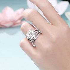 Hand showing a silver heart-shaped monogram ring with crystal-studded stackable bands. Monogram Rings, Engagement Rings And Wedding Rings, Sterling Silver Stackable Rings, Stackable Rings Silver, Silver Monogram, Monogram Ring, Engraved Jewelry, Women Diamond, Elegant Ring