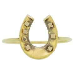 Here we have a charming Victorian horseshoe ring. The horseshoe features some dark tarnishing, we have left this as we feel it adds to the patina. This piece started life as an antique stick pin but has been remodelled into a more practical ring, befitting to todays fashion trends. The band of the ring is 9ct gold and the horseshoe is a higher carat 15/18. Condition: Used (Very Good) Weight: 0.6 grams Ring Size: N (54) Horseshoe Dimensions: 12mm x 10mm Tested As: 9ct Gold & High Carat Gold Head Todays Fashion Trends, Horseshoe Ring, Feel It, Jewelry Rings Engagement, Ring Verlobung, Patina, Period, Jewelry Rings, Ring Size