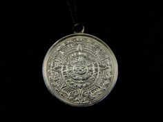 I propose a splendid silver pendant 925 It is a symbol of tradition Azteca, told Aztec Calendar or Sun, well executed, edited and finished, satin background to enhance the design Method of production: done by hand, not made in china, made personally with strap in black waxed cotton dimension diameter 2,50 mm Silver marked and guaranteed Made in Italy Nikel Free Spiritual Silver Jewelry With Coin Pendant, Silver Medallion Necklace In Symbolic Style, Ceremonial Symbolic Sterling Silver Jewelry, Symbolic Sterling Silver Jewelry For Ceremonial Occasions, Antique Silver Symbolic Jewelry With Large Pendant, Ceremonial Silver Jewelry With Large Pendant, Spiritual Silver Etched Jewelry, Ceremonial Silver Pendant Jewelry, Ceremonial Silver Etched Necklace