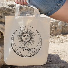 💟 The tote bag for Moon and Sun lover. 💟 The perfect gift for friend, for mom, for sister, or anyone else. ------------------------------------------------------------------------------------------------- ABOUT OUR TOTES ◆ Dimensions: 15 x 15 inches ◆ Material: 100% cotton canvas, with heavy-duty woven handles. ◆ Bag volume capacity, approx. 12 liters. ◆ Strap handles measure 30 inches. ◆ Strap drop (high point of strap to bag opening) measures 11 inches. ◆ Imprint on one side. ◆ Handles featu Cool Tote Bag Design, Tod Bag, Handpainted Tote Bags, Sacs Tote Bags, Tote Bags For School, School Tote, Painted Tote, Gift Totes, Cat Tote