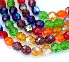 multicolored glass beads on white background