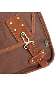 With a stylish design that can be carried by men and women, this flap bag offers plenty of slots to organize all of your essentials when traveling through town. 14"W x 12"H x 5"D; 24" strap drop Textile/leather Imported Brown Shoulder Bag With Zipper Pocket For School, Brown Rectangular Shoulder Bag With Anti-theft Pocket, Brown Satchel Saddle Bag For Outdoor, Brown Saddle Bag Satchel For Outdoor, Brown School Bags With Luggage Sleeve, Brown Bags With Anti-theft Pocket For Daily Use, Brown Crossbody Briefcase With Zipper Pocket, Brown Shoulder Bag With Anti-theft Pocket, Brown Flap Saddle Bag