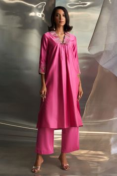 Pink chanderi kurta with placed zari embroidered egyptian motifs, embellished by sequins. Comes with pant and dupatta. - Aza Fashions Festive V-neck Kurta With Pallu, Festive V-neck Kurta For Diwali, Diwali Palazzo Set With Zari Work And V-neck, Dabka Detail Tussar Silk Palazzo Set, V-neck Chanderi Kurta For Diwali, V-neck Palazzo Set With Zari Work For Eid, V-neck Sets With Gota Work For Eid, Silk V-neck Kurta With Dabka Work, V-neck Palazzo Set With Zari Work For Diwali