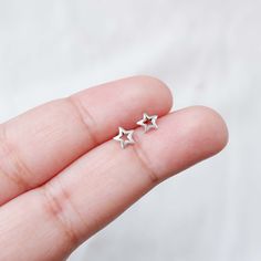 Real 925 Sterling Silver Tiny Hollow Star Stud Earrings These lovely earrings can be used in Earlobe, Tragus and Cartilage. Measures 6mm Comes with pushback backings Sold by Pair Jewelry will come in a gift box * Please read shop policy before placing an order * *JEWELRY CARE* Sterling Silver will tarnish over time, but to help keep your jewelry looking beautiful - Clean with a soft dry cloth after wear and store inside an airtight bag or container. Remember to remove your jewelry when: * Applyi Silver Star-shaped Dainty Jewelry, Silver Star-shaped Pierced Cartilage Earrings, Silver Star-shaped Cartilage Earrings With Pierced Design, Sterling Silver Star-shaped Single Earring, Minimalist Star-shaped Hypoallergenic Jewelry, Hypoallergenic Star-shaped Jewelry, Hypoallergenic Star Shaped Jewelry, Nickel Free Star Shaped Silver Cartilage Earrings, Sterling Silver Star Cartilage Earring