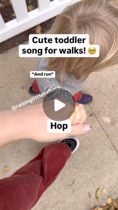 a little boy is holding his hand up to someone's face with the caption, cute toddler song for walks