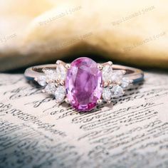 Antique Oval-Cut Pink Sapphire Engagement Ring, 18K Gold Handmade Marquise Moissanite Cluster Bridal Promise Ring, Statement Ring For Love Description: Main Stone - Pink Sapphire (Lab Created) Stone Size - 8x6mm Stone color - Pink Stone shape - Oval Second Stone:- CZ Diamond Stone Color:- Colorless Stone Shape:- Marquise Finishing- Excellent feel free to contact me if you have any questions Gemstone color may slightly vary from listed image due to the nature of all natural gemstone or different monitor settings TURNAROUND TIME Your order will be ready for shipment in 4-8 business days. Free economy shipping for US, UK, Germany- 10-15 business days delivery time. shipping upgrade available for US, UK, Germany- 5-7 business days delivery time. Please check shipping times for other countres b Oval Ruby Ring With Diamond, Oval Ruby Ring With Brilliant Cut Pink Sapphire, Exquisite Pink Sapphire Ring For Anniversary, Exquisite Oval Diamond Ring, Exquisite Pink Sapphire Wedding Ring, Oval Brilliant Cut Pink Sapphire Ring, Oval Ruby Ring With Prong Setting For Wedding, Oval Pink Sapphire Diamond Ring In White Gold, Wedding Ruby Ring With Oval Cabochon