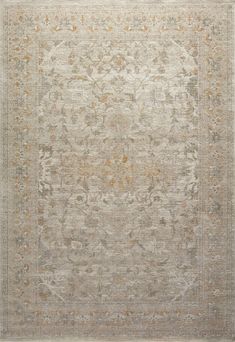 an antique rug with many different colors and patterns on the carpet, including beiges and browns