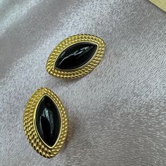 Elevate your style with these stunning vintage style earrings featuring black onyx stones set in 22K gold vermeil. The classic combination of black and gold adds a touch of elegance to any outfit. Perfect for adding a touch of sophistication to your look, these earrings are a must-have accessory. Make a statement with these timeless beauties that will never go out of style. This is simply breathtaking will make a truly ideal gift for that someone special or spoil yourself Luxury Gold Onyx Earrings, Formal Gold Clip-on Earrings With Black Enamel, Black Gold-plated Earrings For Formal Occasions, Formal Black Gold-plated Earrings, Vintage Gold Clip-on Earrings With Black Enamel, Elegant Gold Earrings With Black Enamel, Classic Black Clip-on Earrings As Gift, Classic Black Clip-on Earrings For Gift, Classic Black Clip-on Earrings For Formal Occasions