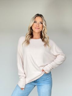 cream Cozy Stretch Crew Neck Knit Top, Snug Soft Knit Tops For Layering, Cozy Stretch Knit Top With Crew Neck, Relaxed Fit Soft Knit Comfortable Tops, Soft Knit Tops With Relaxed Fit, Soft Textured Long Sleeve Tops For Spring, Super Soft Long Sleeve Sweater For Everyday, Snug Solid Sweater For Loungewear, Super Soft Long Sleeve Sweater