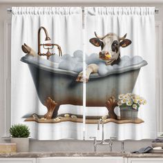 a cow taking a bath in a tub with flowers on the counter and curtains behind it