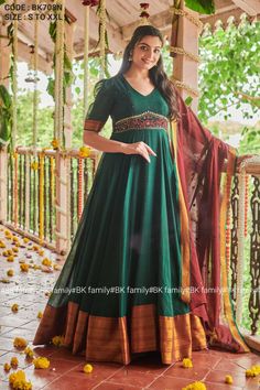 Take your fashion to the next level with our Green South Cotton Handloom Dress. It fuses tradition and modernity, crafted from Handloom Narayanpet fabric with intricate handwork. It features a broad golden border in the flair, a generous flair, and an elegant V-neck. Paired with a Handloom Narayanpet dupatta adorned with a border and mirror work, it blends classic charm and contemporary fashion. (Side zip attached) *Name- South Cotton Handloom Green Dress* *Size- S to XXL* *Dress Fabric-Naraynpet, Cotton* *Dress Length- 55inches* *Color- Green* Saree Dress Design Ideas, Indian Gown Design, Handloom Dress, Diwali Dresses, Simple Frock Design, Lehenga Saree Design, Latest Designer Dresses, Traditional Gowns, Long Gown Design